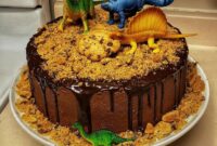 Contoh kue ultah tema dinosaurus