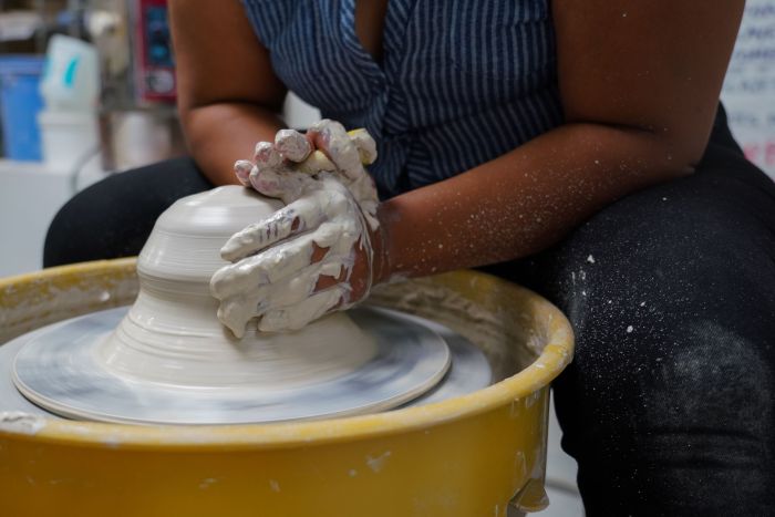 Making pottery clay potter vase stock